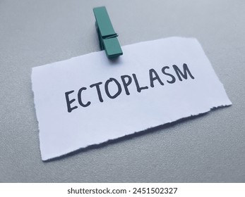Ectoplasm writting on table background.