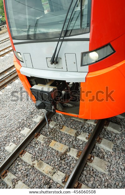ectric train on the\
railway. Vertical image.