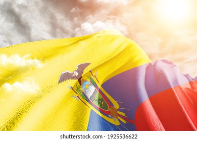 Ecuador national flag cloth fabric waving on beautiful grey sky. - Powered by Shutterstock