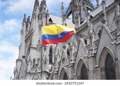 Ecuadorian flag flying in front of the basicilica de Voto nacional in Quito, Ecuador