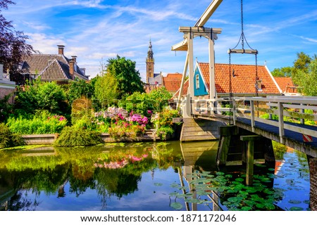 Edam town in North Holland, Netherlands, view of the historical wooden Kwakelbrug bridge and traditional houses in the Old town center
