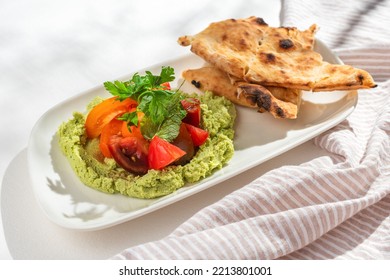 Edamame Hummus With Fresh Tomatoes On White Background For Restaurant Menu.