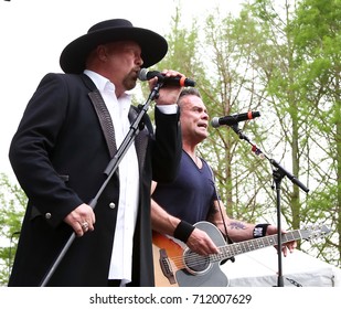 Eddie Montgomery (L) And Troy Gentry Of Montgomery Gentry Performs Onstage During The ACM Party For A Cause Festival At Globe Life Park In Arlington On April 17, 2015 In Arlington, Texas.