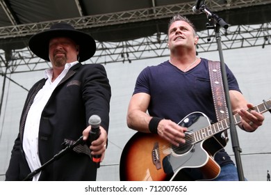 Eddie Montgomery (L) And Troy Gentry Of Montgomery Gentry Performs Onstage During The ACM Party For A Cause Festival At Globe Life Park In Arlington On April 17, 2015 In Arlington, Texas.