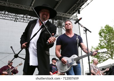 Eddie Montgomery (L) And Troy Gentry Of Montgomery Gentry Performs Onstage During The ACM Party For A Cause Festival At Globe Life Park In Arlington On April 17, 2015 In Arlington, Texas.