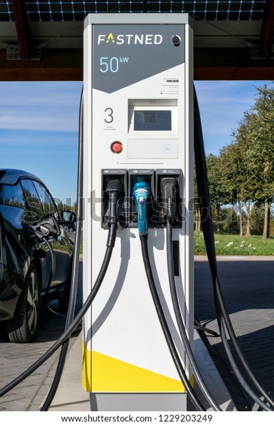 EDE, THE NETHERLANDS - OCTOBER 28, 2018: Fastned\
electric vehicle charging station. Fastned operates a network of\
fast charging stations along highways and in cities in the\
Netherlands and Germany.