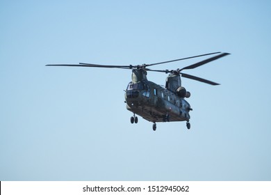 EDE, NETHERLANDS - SEPTEMBER 19TH, 2019: Chinook helicopter from the Royal Dutch Air force low flyby on a clear blue sky.