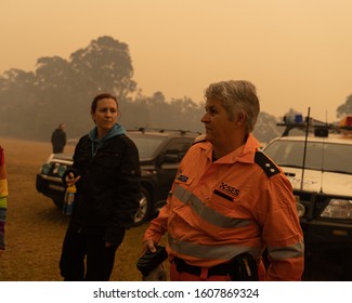 Eden, Australia - January 1, 2020: A State Emergency Services Commander Gives Updates To Bushfire Evacuees At The Eden Evacuation Center As It Is Shrouded In Thick Bushfire Haze On New Year's Day 2020