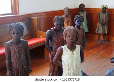 Edgard, Louisiana, U.S.A - February 2, 2020 - The statues of the African American children inside the church near Whitney Plantation