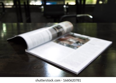 Edge Book On The Wooden Table.
Stacking Magazine Wood  Desk Background.    
(selective Focus )