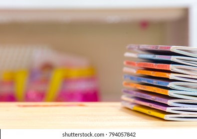 Edge Book On The Wooden Table.  
Stack Magazines On Wood  Desk.    
School Education Concept.
(selective Focus )