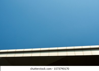 The Edge Of Building Roof And The Copy Space On Clear Blue Sky