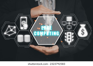 Edge computing modern IT technology concept, Businessman hand holding edge computing icon on virtual screen, Business, technology, internet and networking.
