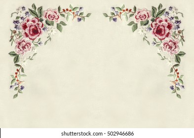 Edge with corners of embroidery roses with small flowers and leaves 
