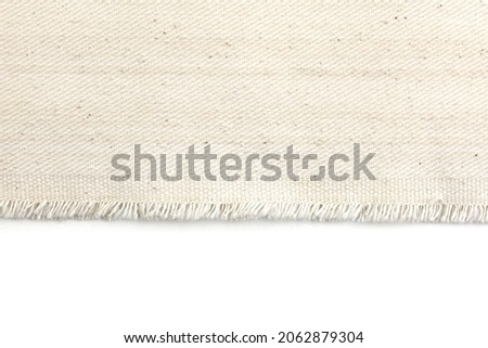 Edge of fabric canvas texture on white background. Foto d'archivio © 