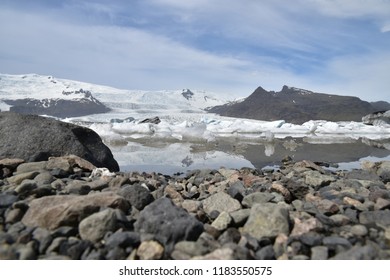 at the edge of a ice lake, thats comes from the glacier