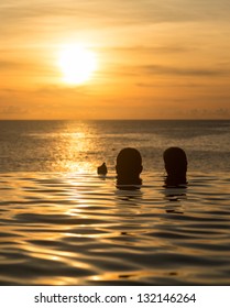 Edge Of Infinity Swimming Pool Overlooking Ocean At Sunset