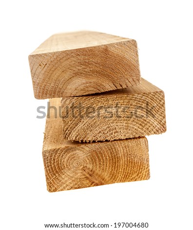 Edge of three cedar two by four wood boards on white background