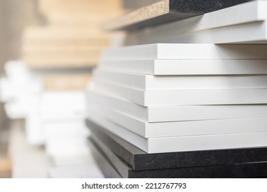 Edges of boards made of laminated chipboard, details of cabinet furniture in the assembly shop. Background with selective focus and copy space - Shutterstock ID 2212767793