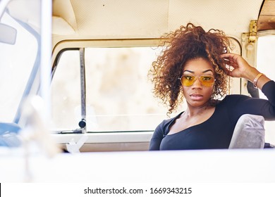 Edgy African American Model Posing In Vintage Vehicle Interior