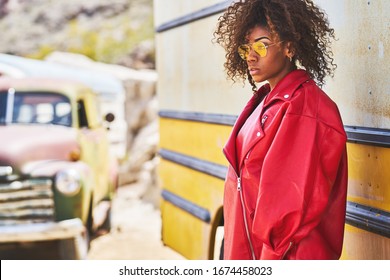 edgy african american model posing in red jacket