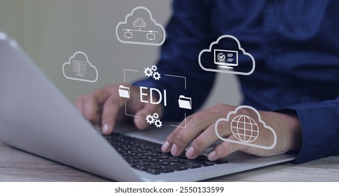 EDI, electronic data interchange concept, Person using computer on office desk with virtual screen electronic data interchange icon.