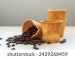 Edible cookie coffee cup filled with coffee bean, eco friendly alternative for takeaway cup.