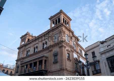 Edificio Coliseo, an iconic modern building in Seville, blending contemporary architecture with traditional Spanish design, located in the city center.