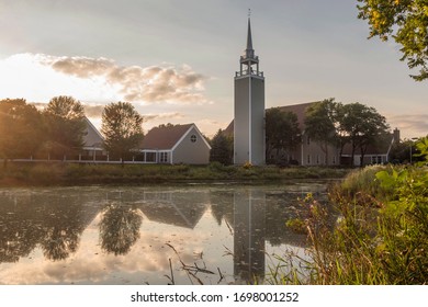 The Edina Colonial Church and Reflections at Sunset