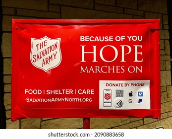 Edina, Minnesota,USA. December 13, 2021. A large banner for the Salvation Army is on a temporary display in front of a building in Minnesota.
