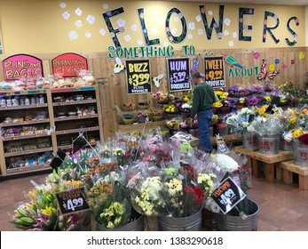 Edina, MN/USA. April 27, 2019. A man looks at flowers inside a Trader Joe’s grocery store in Minnesota.