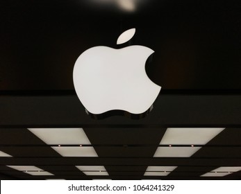 Edina, MN/USA April 6, 2018. The Apple sign lit up at an Apple Store in Edina, Minnesota.