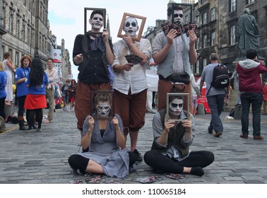 EDINBURGH- AUGUST 11: Members Of Minotaur Theatre Company Publicize Their Show Oedipus During Edinburgh Fringe Festival On August 11, 2012 In Edinburgh