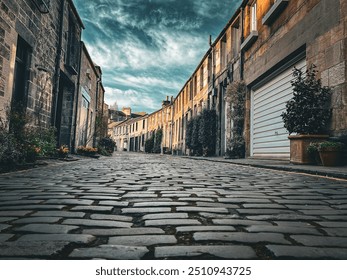 Edinburgh, Circus lane dramatic view with cloudy sky and close up cobblestones street - Powered by Shutterstock