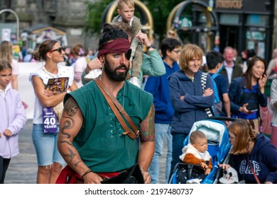 Edinburgh Festival Fringe 2022-5 Aug-29 Aug Edinburgh UK. Performers On The Street. Actors Of Street Theater And Musicians In Capitol Of Scotland. A Comedy Actor Performed On The Royal Mile. 