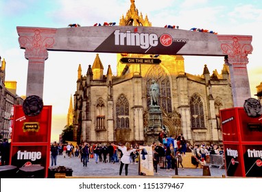 Edinburgh Festival Fringe Banner, Sponsored By Virgin Money, On The Royal Mile With St Giles Cathedral In The Background.  Annual Arts Festival In Edinburgh City. Scotland UK. August 2018