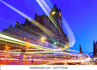 Edinburgh at night scene with Lights streak from high-sided vehicles on Princess street