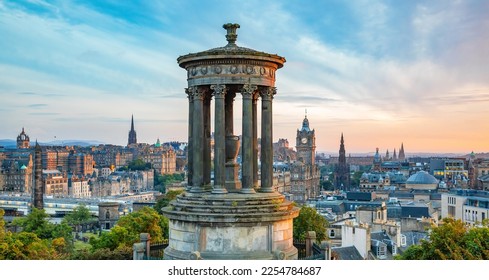 Edinburgh scenic skyline at sunset, panoramic view from Calton Hill, Scotland travel photo. Dugald Stewart monument on foreground. - Powered by Shutterstock