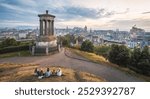 Edinburgh scenic skyline at sunset, wide panoramic view from Calton Hill. Cityscape of Edinburgh during blue hour