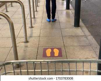 EDINBURGH, SCOTLAND - 14 April 2020 Safe Distance Between Supermarket Trolley And Person At The Front In The Queue To Enter A Branch Of Sainsbury’s In Edinburgh