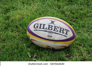 EDINBURGH, SCOTLAND - 22 September 2020 One Dirty Gilbert Rugby Ball On Green Grass