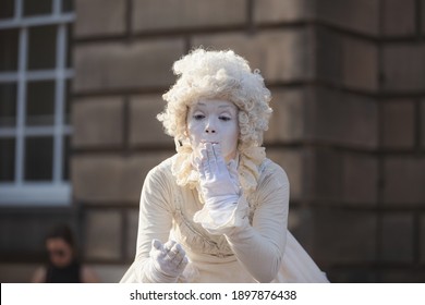 Edinburgh, Scotland - August 16 2016: A costumed pantomime street performer along the historic Royal Mile in Edinburgh, Scotland at the annual Fringe Festival.