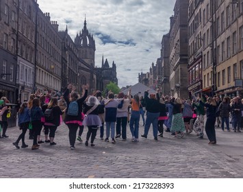 Edinburgh, Scotland - May 7, 2022: Silent Disco Tour, People Singing And Dancing Along The Royal Mile, Edinburgh