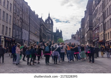 Edinburgh, Scotland - May 7, 2022: Silent Disco Tour, People Singing And Dancing With Headphones Along The Royal Mile