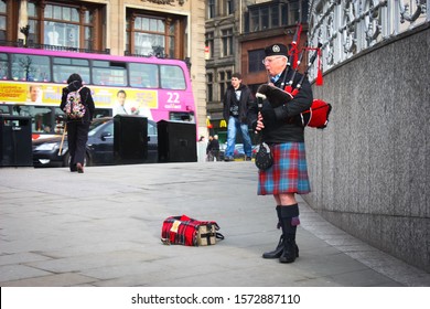 Edinburgh Scotland On March 3, 2010. View Of A Man Playing The Bagpipes In Edinburgh.