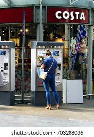 EDINBURGH, SCOTLAND, UK : 17 August 2017. Customer Buying Railway Tickets From A Train Ticket Booth At Edinburgh Wayerlay Train Station.