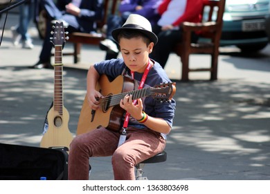 Edinburgh, Scotland, UK - August 14 2014. Young Street Performer With Guitar At Edinburgh Festival Fringe.