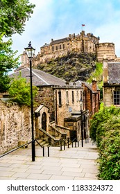 Edinburgh, Scotland, UK: The Edinburgh Castle viewd from the Vennel as it dominates the skyline of the city of Edinburgh from its position on top of the Castle Rock