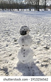 Edinburgh, Scotland  UK - February 9 2021: Snowman With Covid Mask In The Meadows