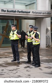 EDINBURGH, SCOTLAND, UK - September 18, 2014 - Police Men Guarding Scottish Parlament Building On Independence Referendum Day